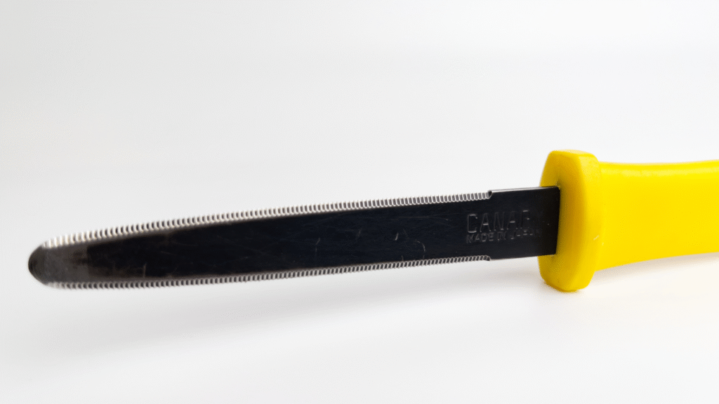 Close-up of the Canary DC-190FC-1 cardboard cutter blade and handle on white background
